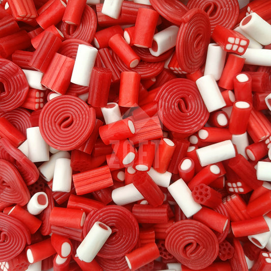 Mix van rood-witte snoepjes met rolletjes, sticks en zachte vulling in kerstkleuren