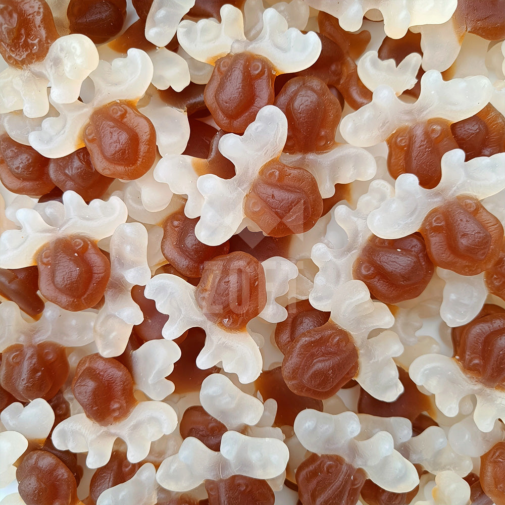 Snoepjes in de vorm van rendieren met colasmaak en witte gewei-details