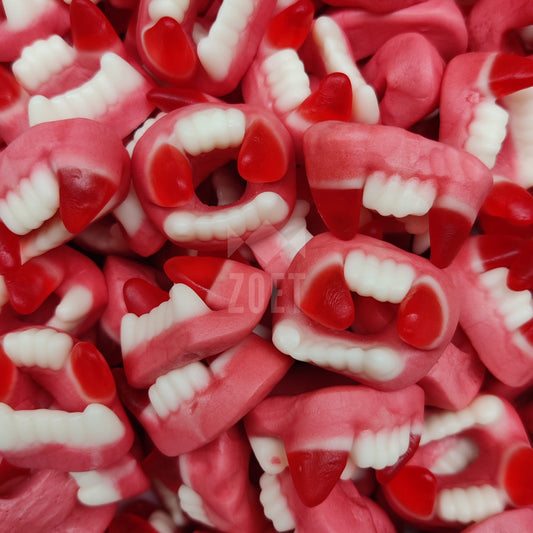 trolli vampierentanden snoepjes, roze witte tandvorm met hoektanden, halloween snoep